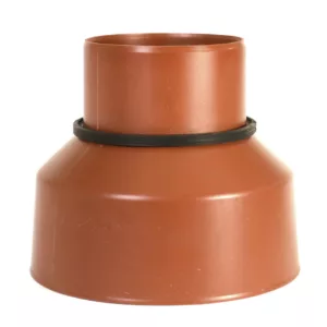 Shrinkable coupling for connecting plastic building drainage pipes to concrete pipes.